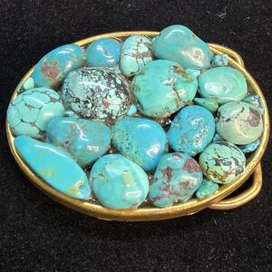 Vintage turquoise in a gold tone setting belt buckle. Unisex.